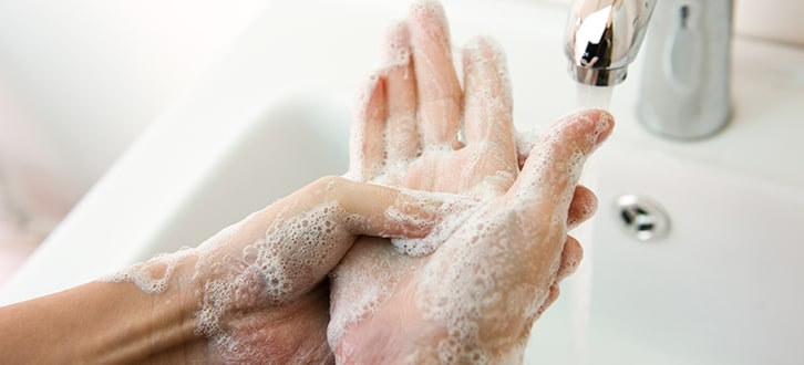 A person washing their hands