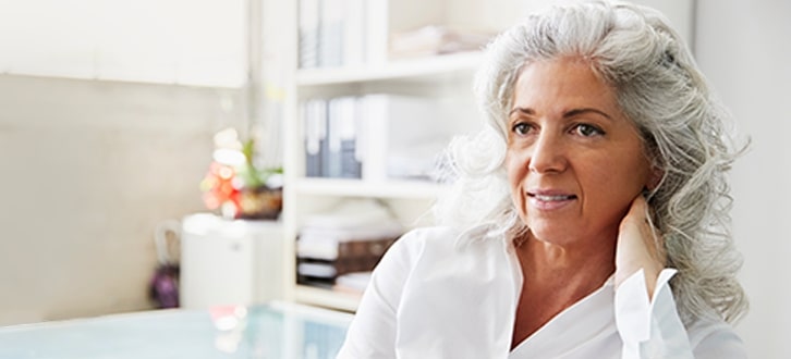 a woman at home learning about colorectal cancer
