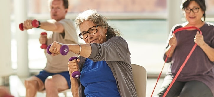 An older woman working out to manage her health