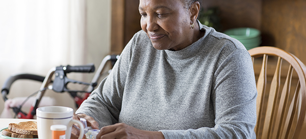 a woman at home with her medications 