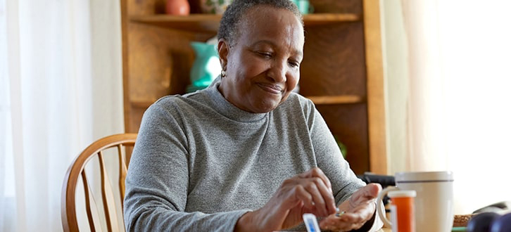 Older woman counting pills