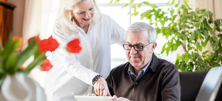 older couple looking at tablet