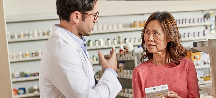 Pharmacist talking to patient