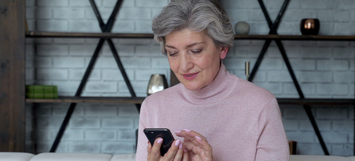 A new CenterWell Pharmacy customer using their cellphone to get started with managing their medications online. 