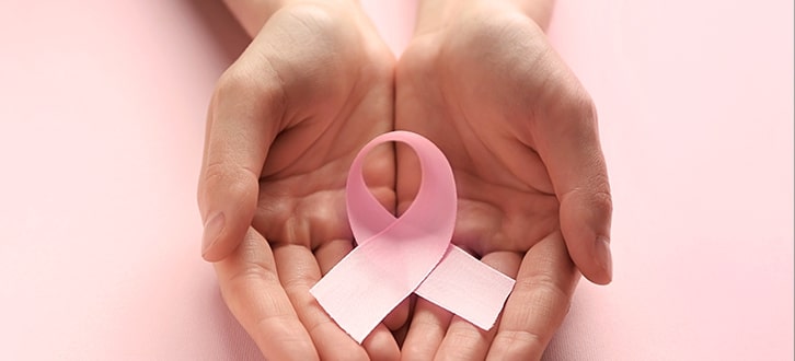 Breast Cancer Ribbon in Hands