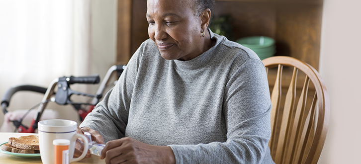 a woman at home with her medications