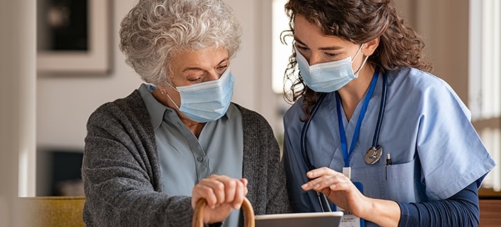 A woman speaking to a medical professional